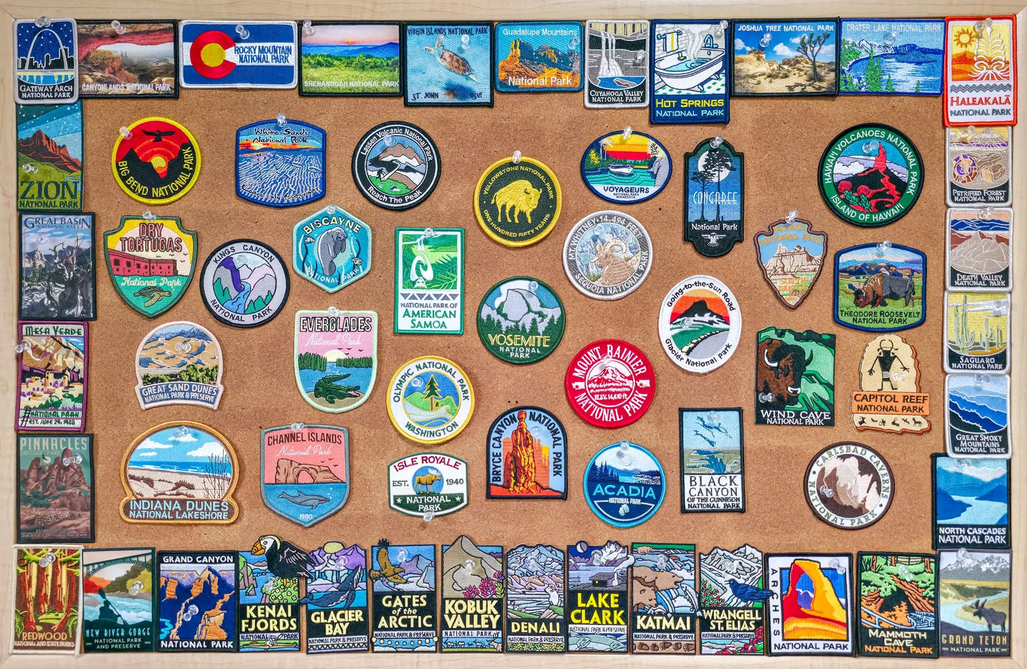 A board of all 63 US National Park patches, one for each park I visited